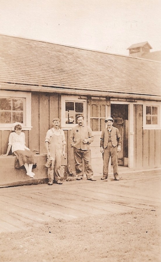 Shattuck Dairy - girl, 3 men shop door open