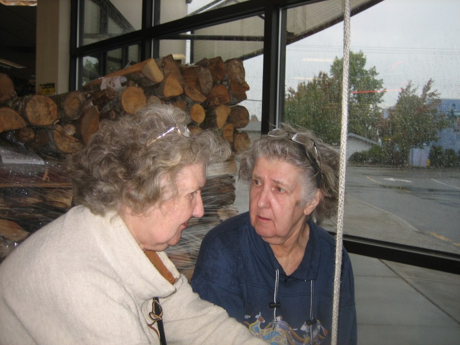 Zora and Sharka ringing the bell at Lambs Thriftway