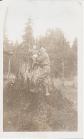 Roderick MacKay working on a stump with son Darrell