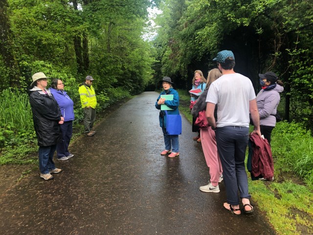 Elaine guiding the Fanno Creek Trail history walk, May 2022