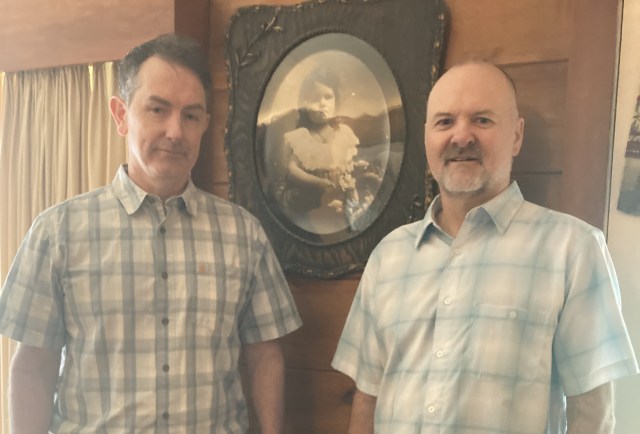 Zachary and Lee Hyslin in front of Grandmother Catherine Hyslin's portrait