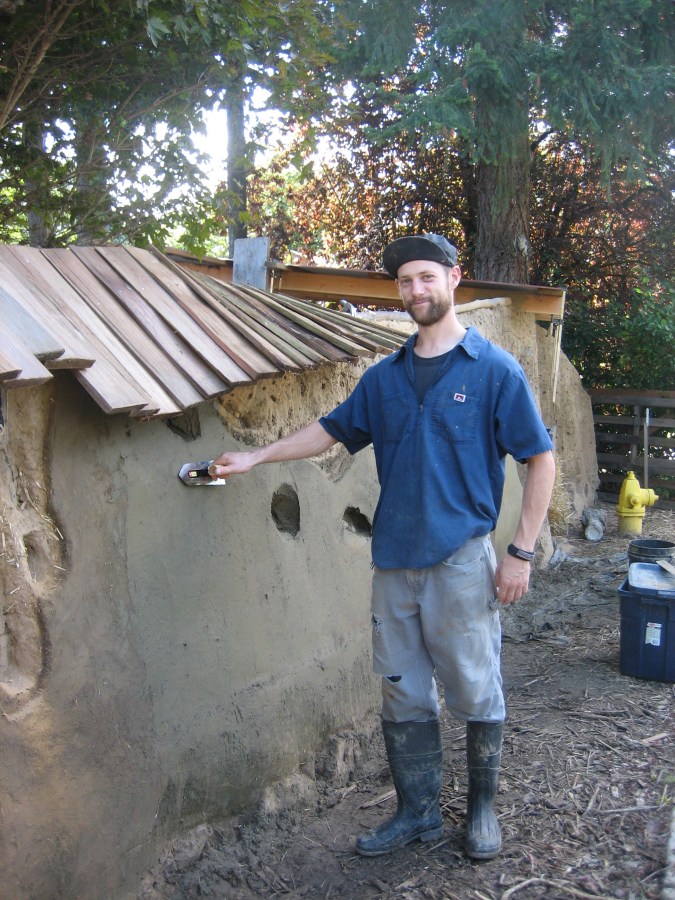 Jeremy Krehpiel applying plaster coat, 2010